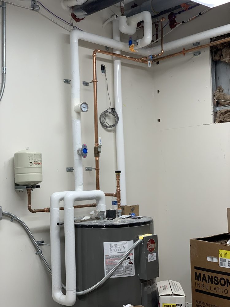 Water heater room, fiberglass with PVC fitting covers