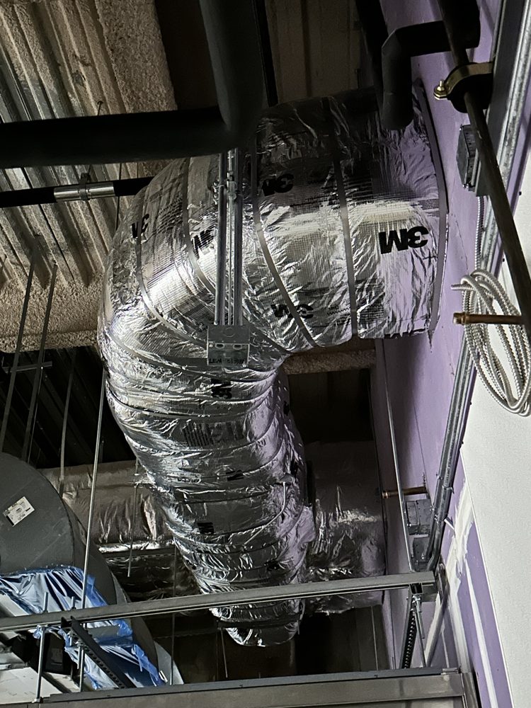 Fire-rated duct wrap with stainless banding