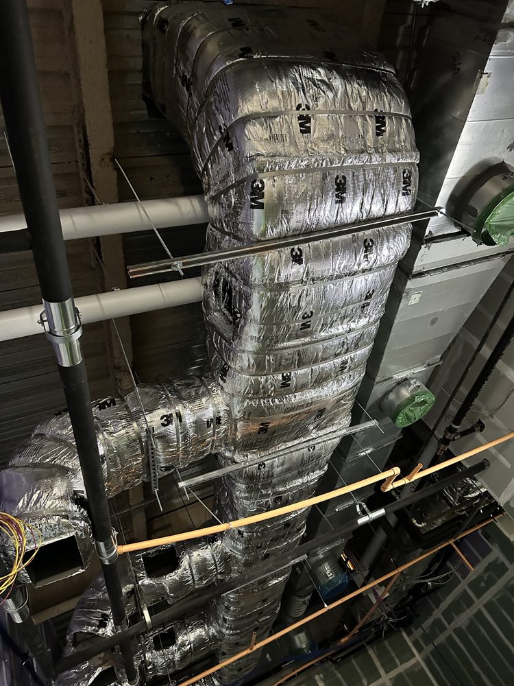 Fire-rated duct wrap on duct mains and branches